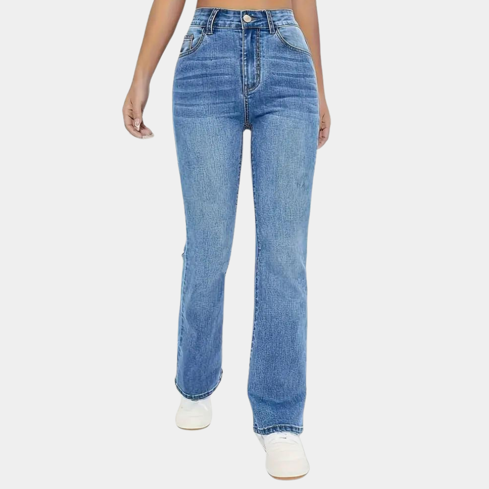 Blue jeans worn by a person on a white background