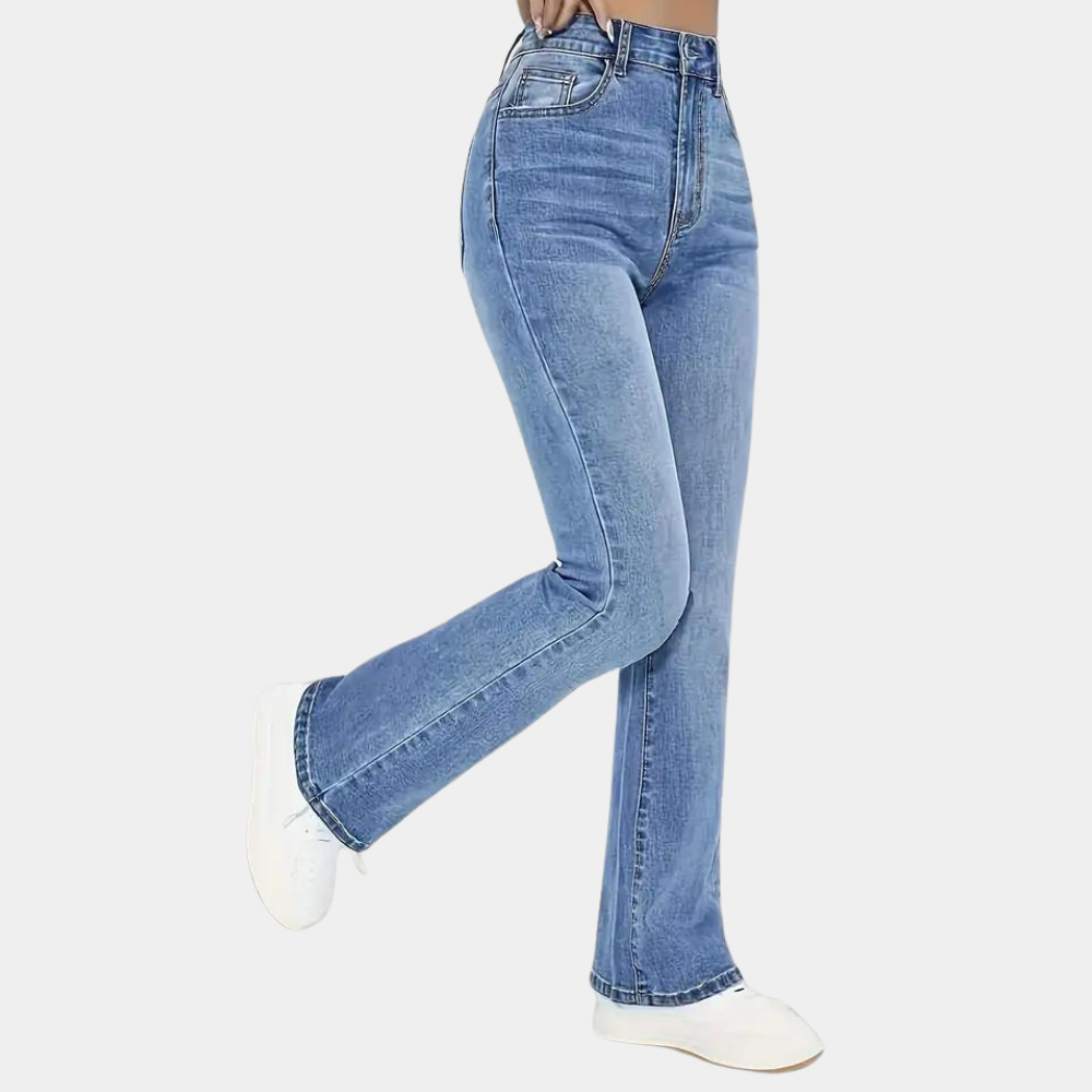 Blue jeans worn by a person on a white background