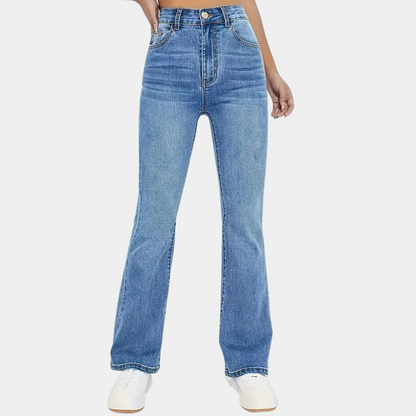Blue jeans worn by a person on a white background