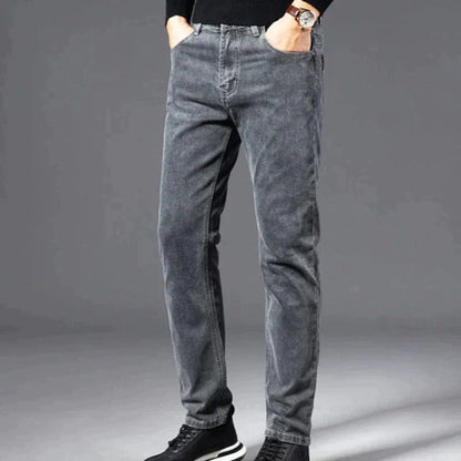 Gray jeans worn by a person on a gray background