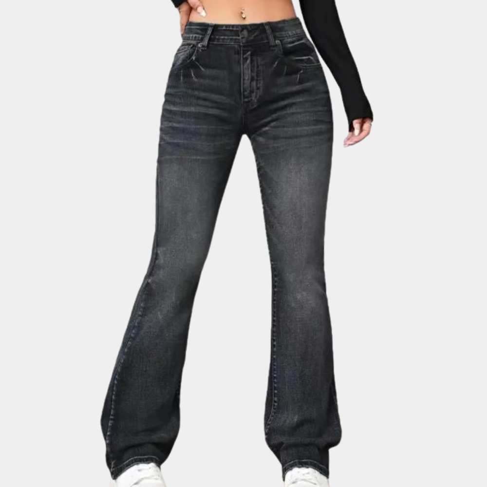 Black jeans worn by a person on a white background