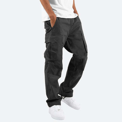 Person wearing black cargo pants on a white background