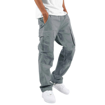 Person wearing gray cargo pants on a white background
