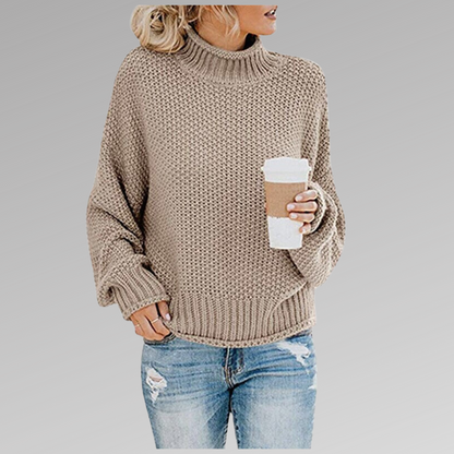 Woman in beige knit sweater with coffee mug, casual fashion, autumn outfit.