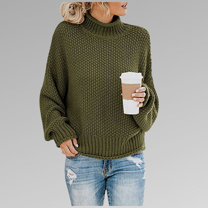 Woman in green knit sweater with coffee mug, casual fashion, autumn outfit.