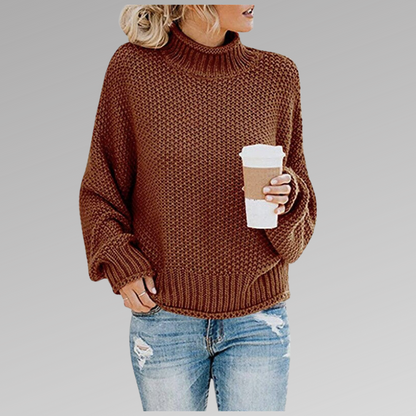 Woman in brown knit sweater with coffee mug, casual fashion, autumn outfit.