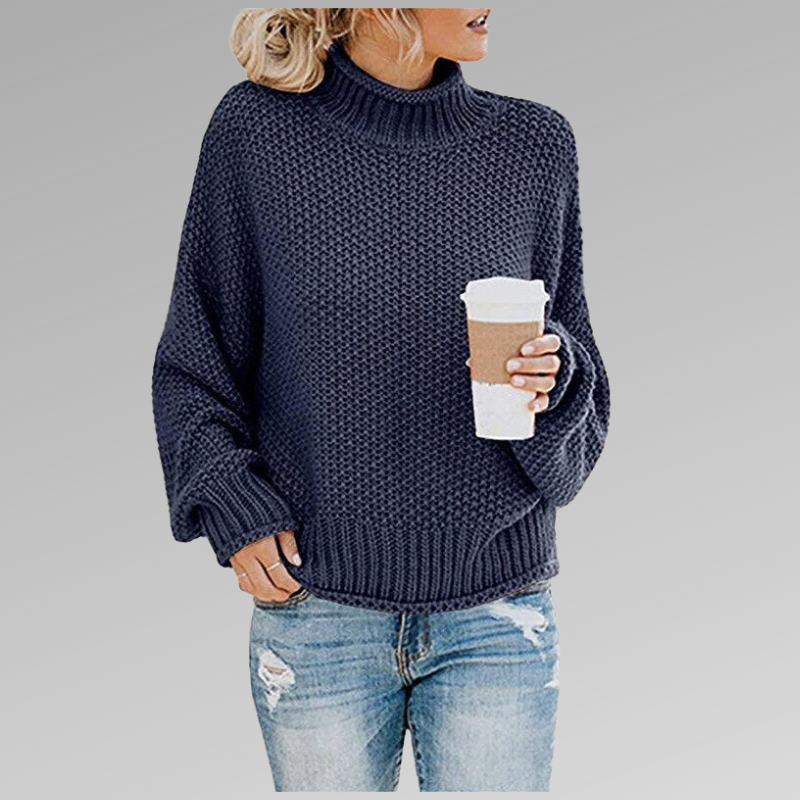 Woman in dark blue knit sweater with coffee mug, casual fashion, autumn outfit.