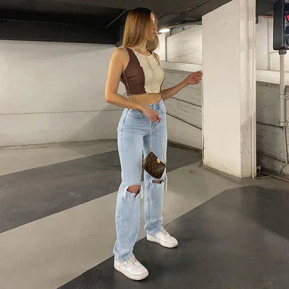 Woman in a casual outfit standing in an indoor setting
