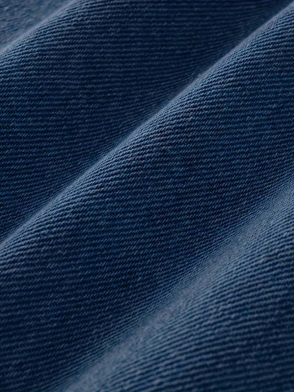 Close-up of blue fabric with a textured pattern