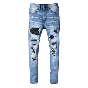 Distressed blue jeans on a white background