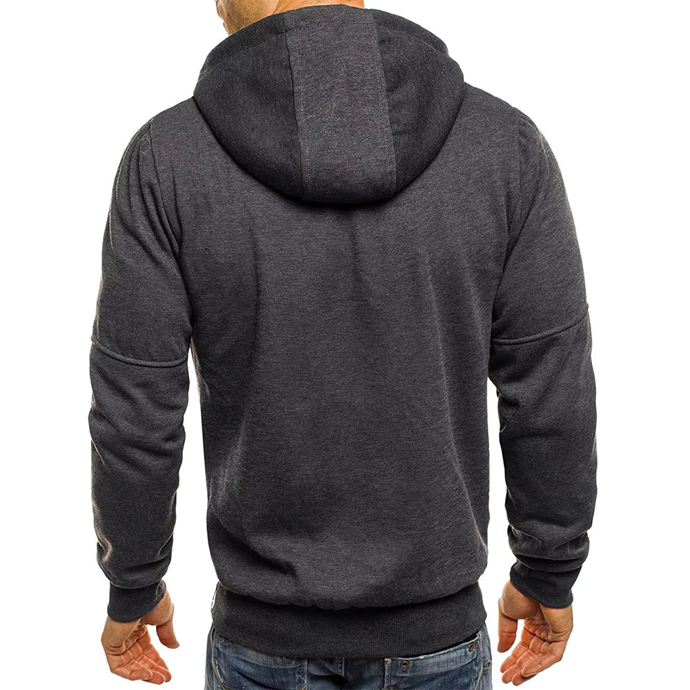Dark gray hoodie worn by a person on a white background