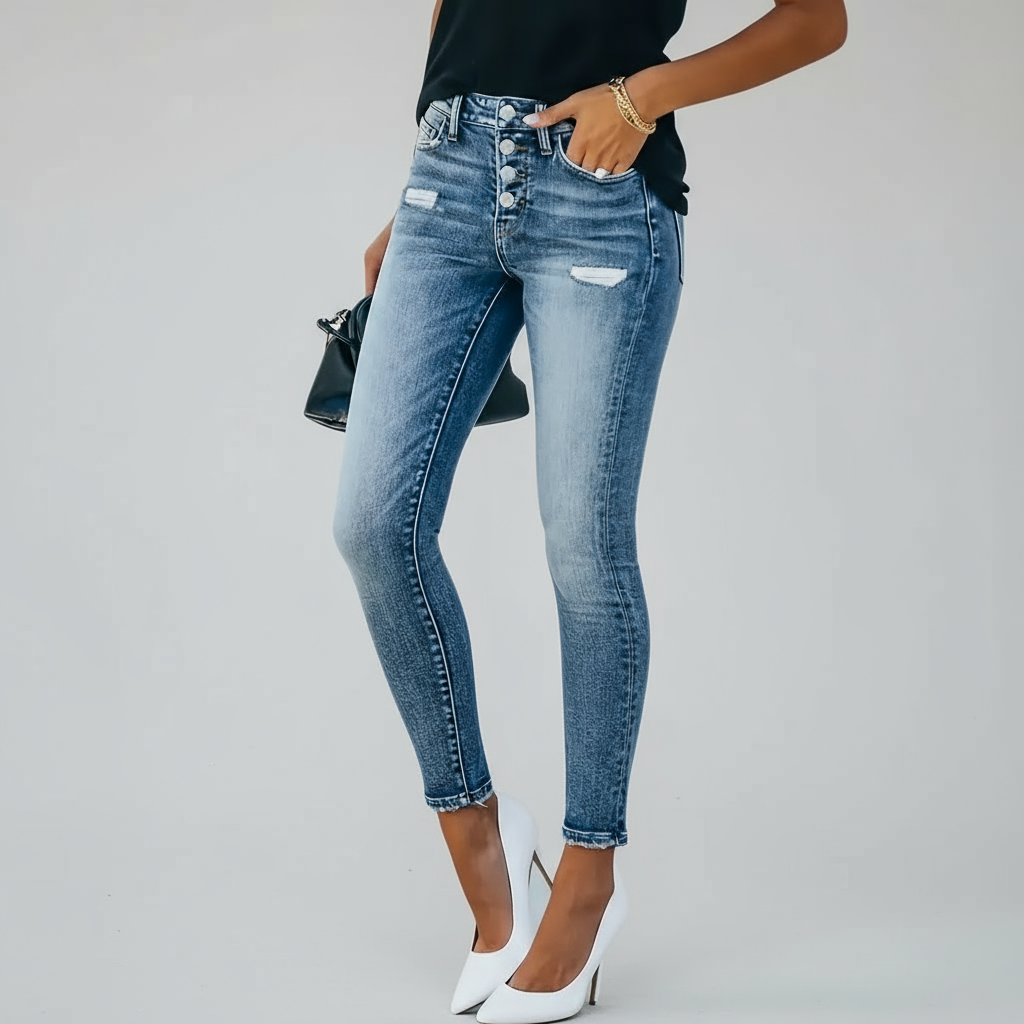 Person wearing blue jeans on a white background